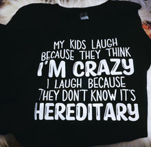 Load image into Gallery viewer, My Kids Laugh Because They Think I'm Crazy I Laugh Because They Don't Know It's Hereditary Black Tee