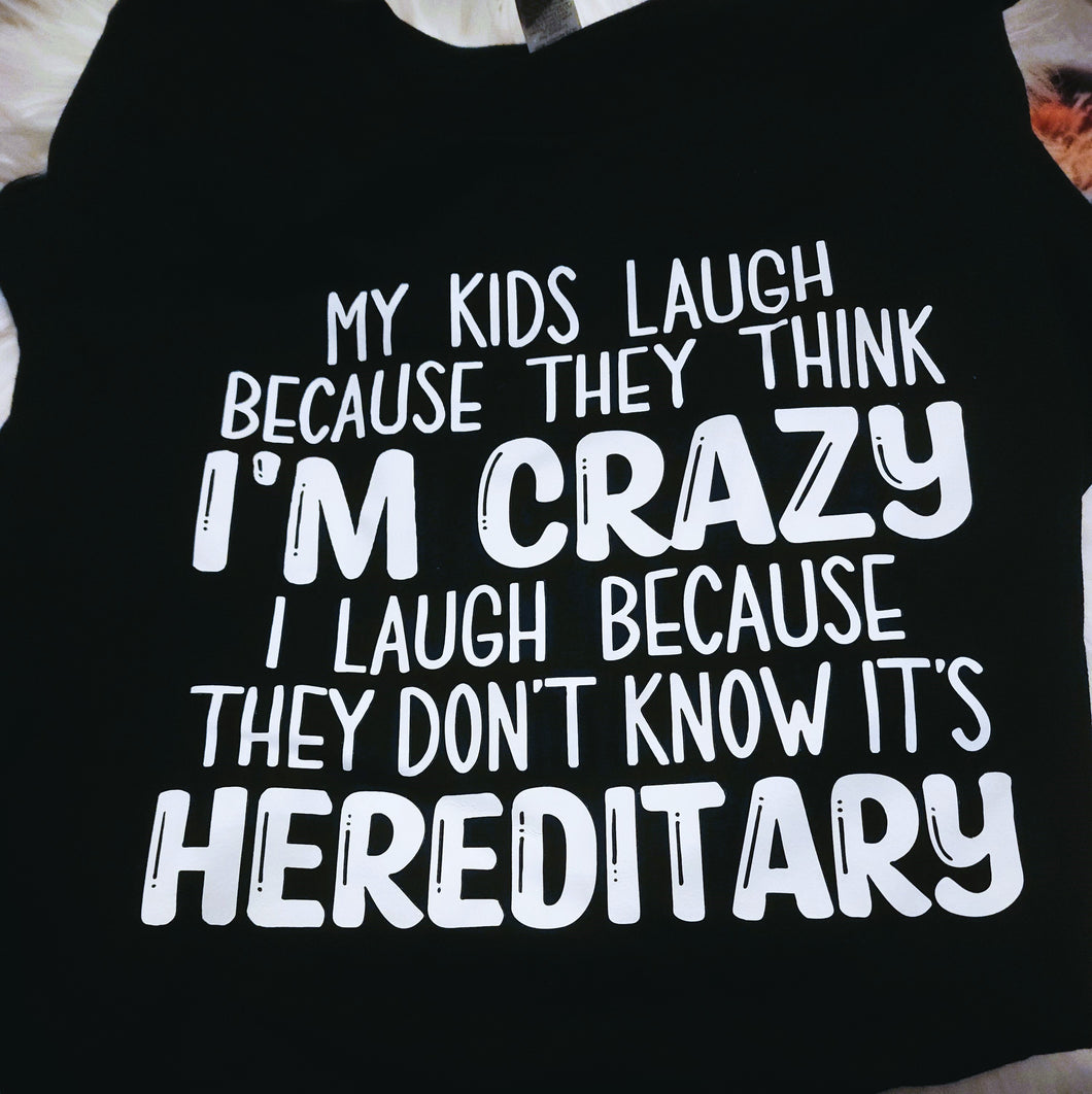 My Kids Laugh Because They Think I'm Crazy   I Laugh Because They Don't Know It's Hereditary Black Tee