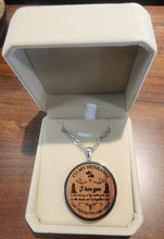 Load image into Gallery viewer, Wooden pendant necklace with engraved message in a jewelry box on a wooden surface
