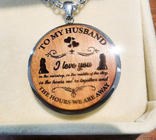 Load image into Gallery viewer, Wooden pendant with engraved message 'To my husband, I love you' on a soft beige background
