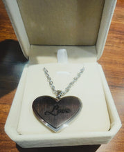 Load image into Gallery viewer, Heart-shaped pendant with 'Love' engraving in a jewelry box
